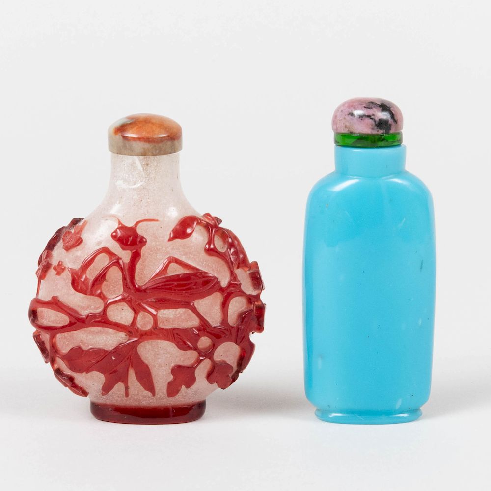 Appraisal: Two Chinese Glass Snuff Bottles Comprising A blue glass example