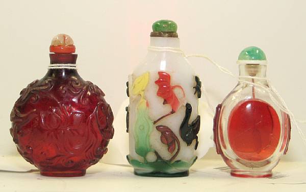 Appraisal: Three glass snuff bottles Including one of translucent red glass