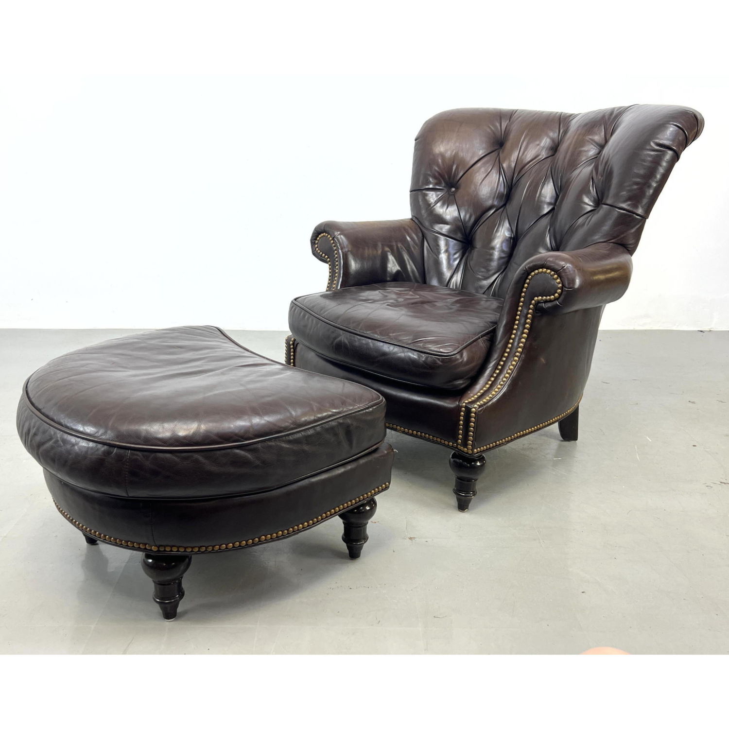 Appraisal: Century Chesterfield style Leather Chair and Ottoman Dimensions H inches