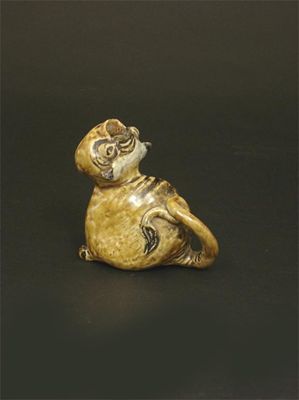 Appraisal: A Martin Brothers stoneware grotesque possibly a toothpick holder modelled