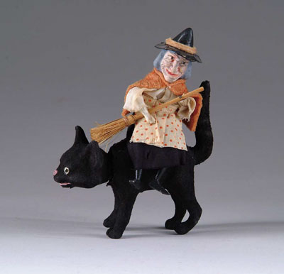 Appraisal: WITCH ASTRIDE A NODDING BLACK CAT A comical little Halloween