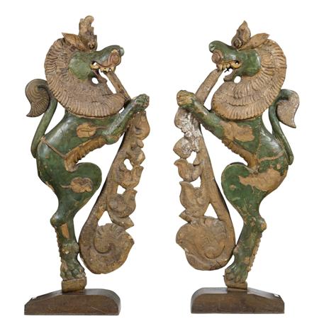 Appraisal: PAIR OF TIBETAN PAINTED CARVED WOODEN TEMPLE GUARDIANS the standing