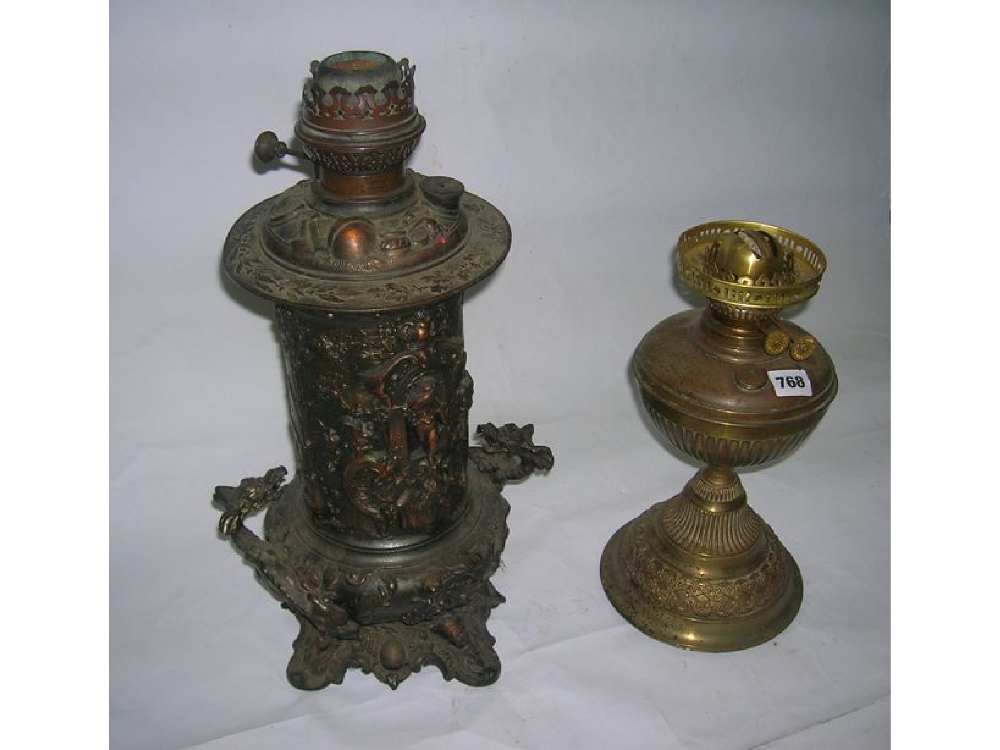 Appraisal: An early th century pressed brass decorated table lamp with