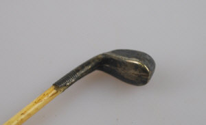 Appraisal: Of golfing interest - bone hat pin having metal golf