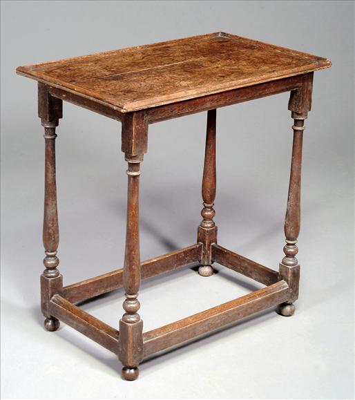 Appraisal: An oak side table mid th century the domed rectangular