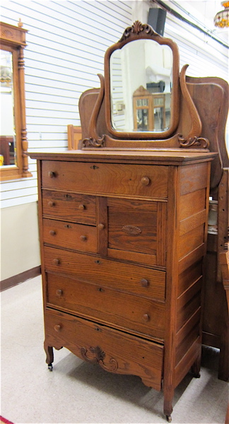 Appraisal: LATE VICTORIAN OAK TALL DRESSER American c the tall chest