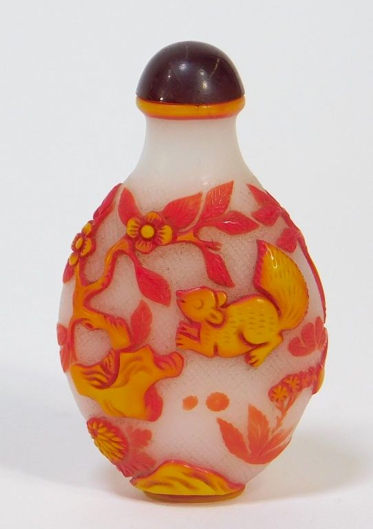 Appraisal: Chinese Carved Peking Glass Squirrel Snuff Bottle China th Century