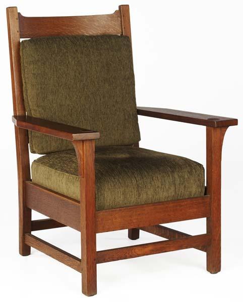 Appraisal: GUSTAV STICKLEY Armchair no with drop-in spring seat and cushion