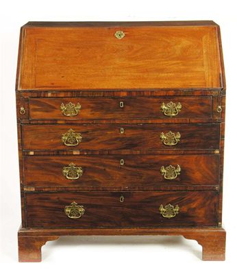 Appraisal: A late George III mahogany bureau the interior with pigeon