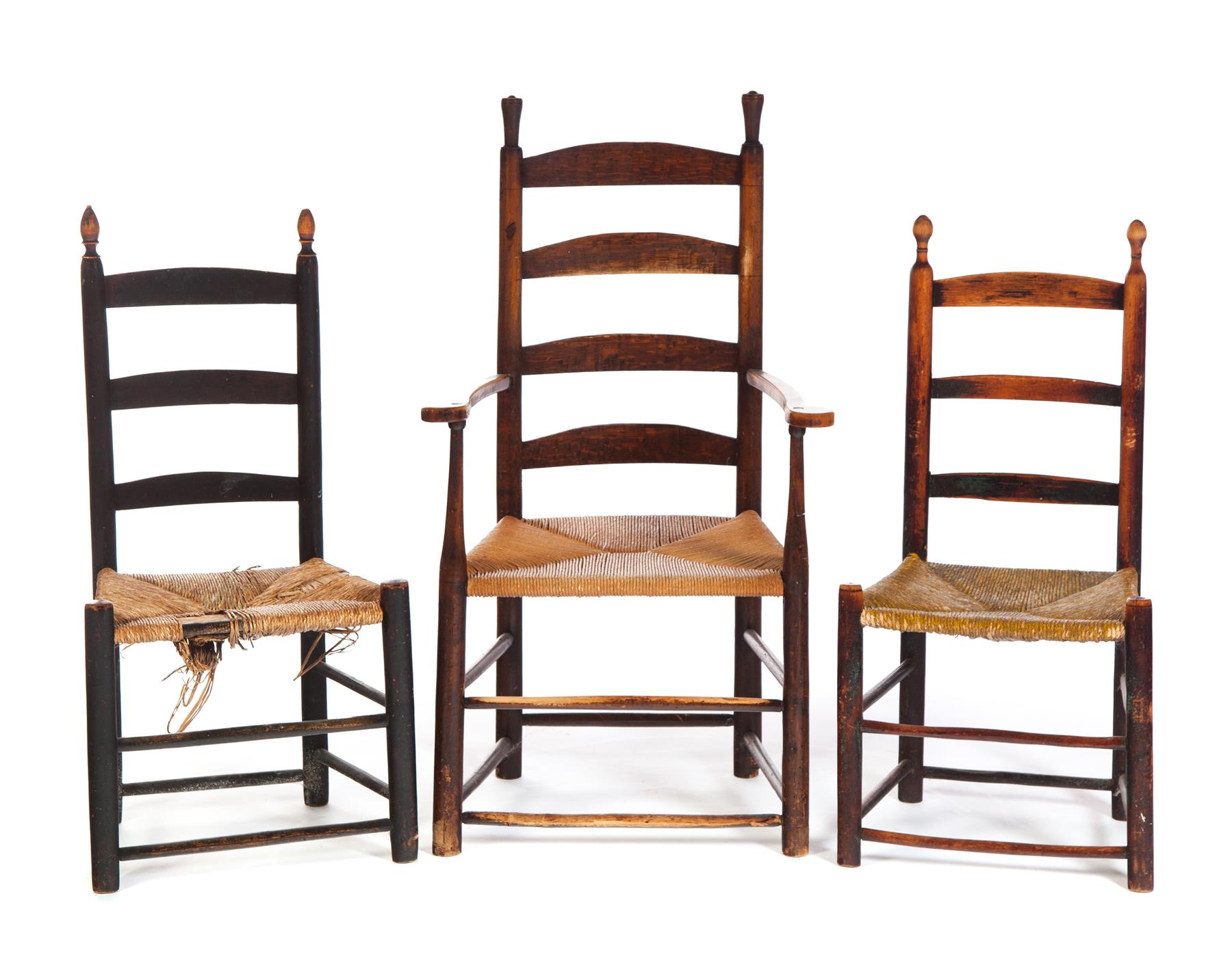 Appraisal: THREE AMERICAN LADDERBACK CHAIRS Nineteenth century Rush seats Armchair in