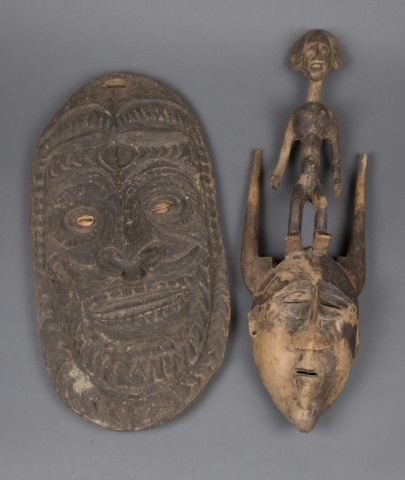 Appraisal: Two Hand Carved Wooden Masks One from Papa New Guinea