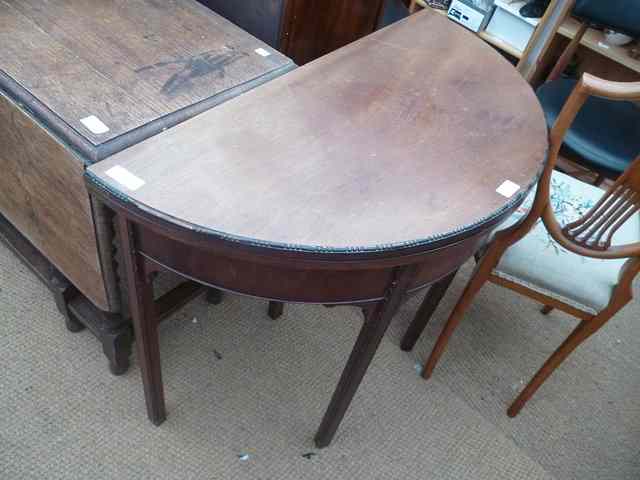 Appraisal: A MAHOGANY 'D' SHAPED FOLD OVER CARD TABLE with beaded