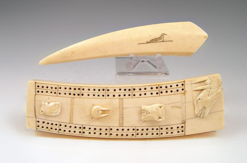 Appraisal: ALASKAN IVORY CRIBBAGE BOARD With figural wolf bear and walrus