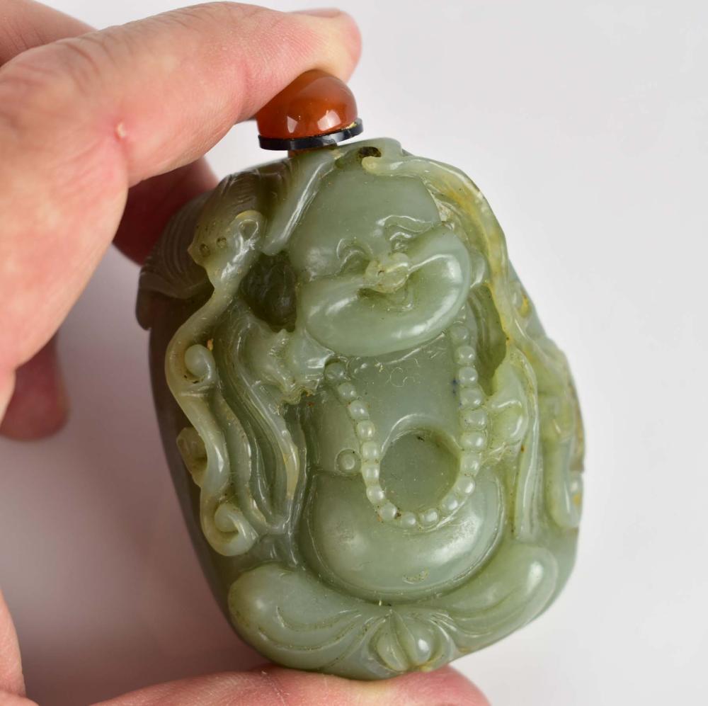 Appraisal: CHINESE MOSS GREEN JADE SNUFF BOTTLEOf pebble form decorated with