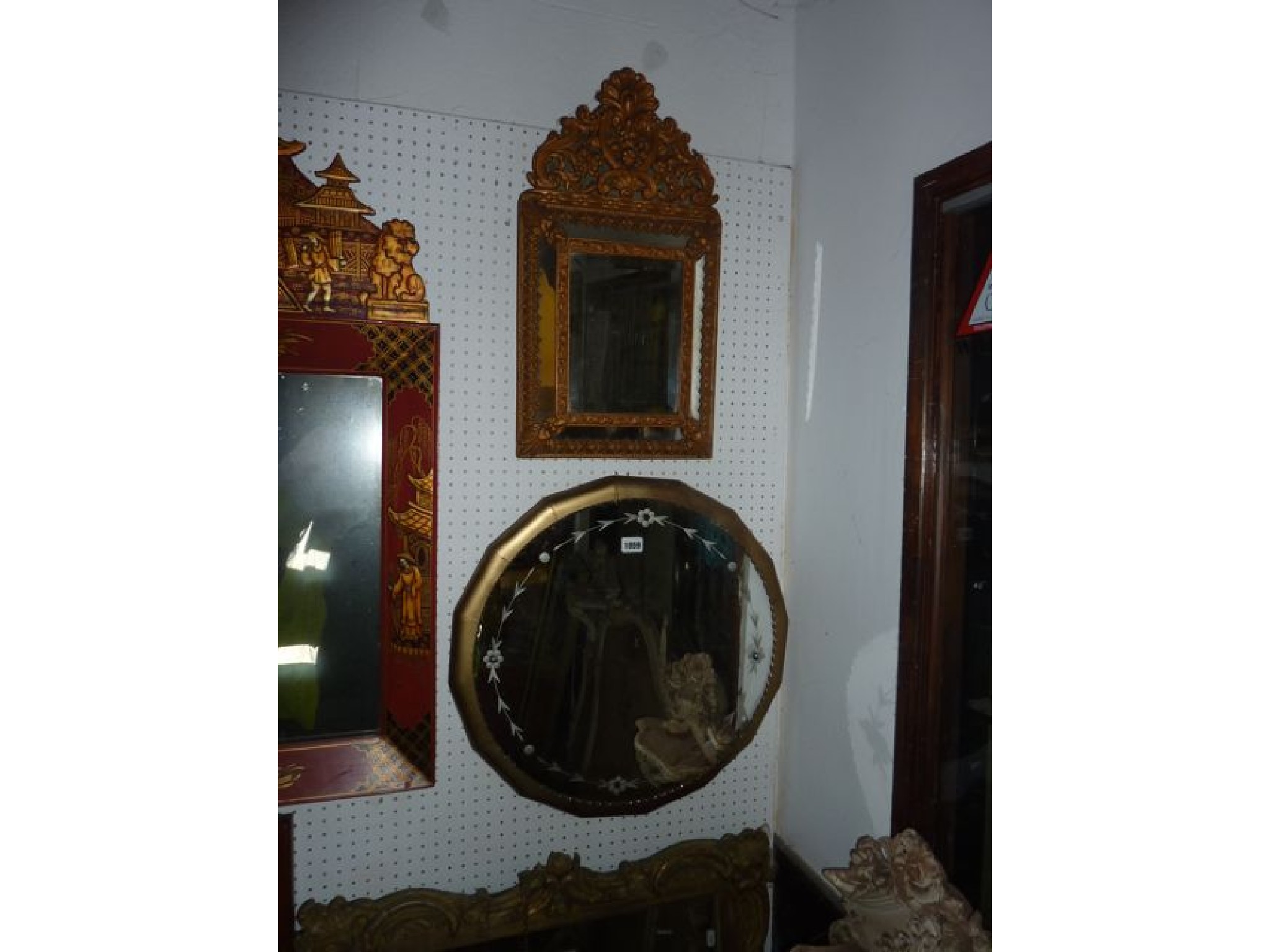 Appraisal: A th century continental wall mirror with painted and embossed