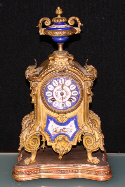 Appraisal: A late th Century gilt metal and porcelain clock cm