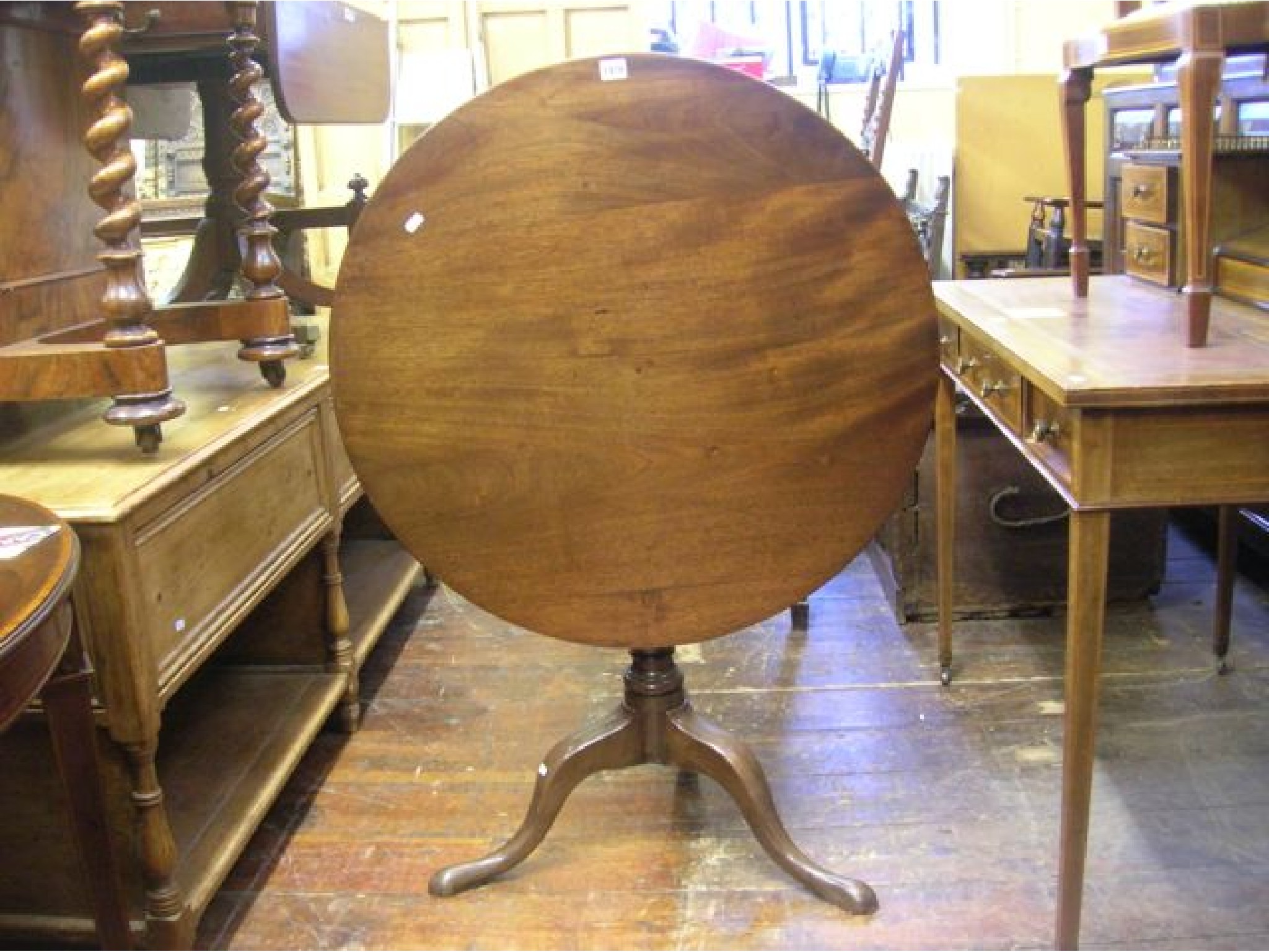 Appraisal: A th century mahogany snap top table with birdcage action