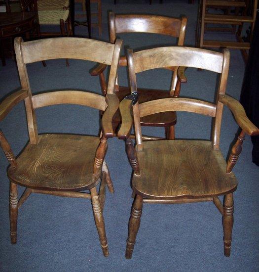 Appraisal: Three armchairs with horizontal splats to the backs with solid