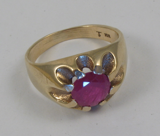 Appraisal: RUBY AND TEN KARAT GOLD RING centering a round-cut ruby