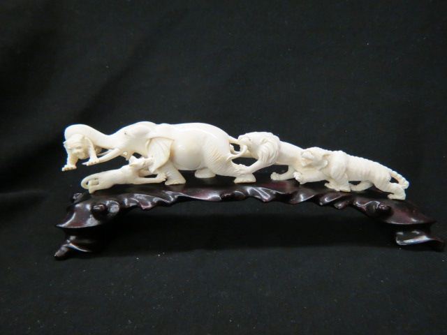 Appraisal: Carved Ivory Tusk group of animals an elephant holding tiger