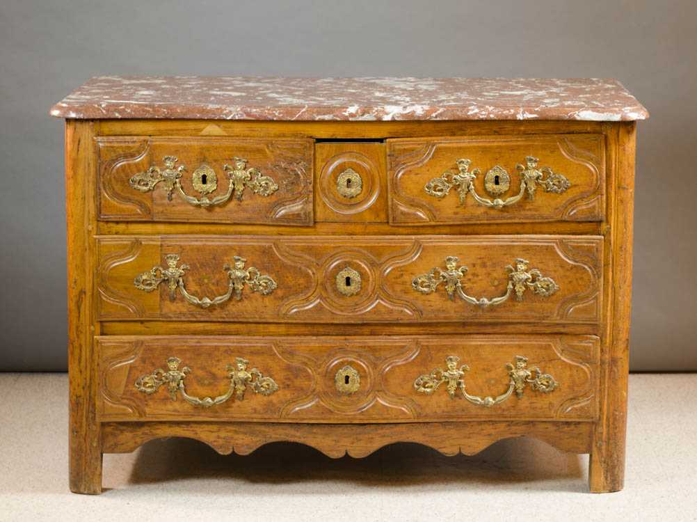 Appraisal: PROVINCIAL PERIOD WALNUT COMMODE French th century the serpentine front