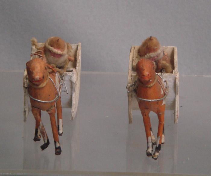 Appraisal: paper mache reindeer and Santa sleighs losses to antlers legs