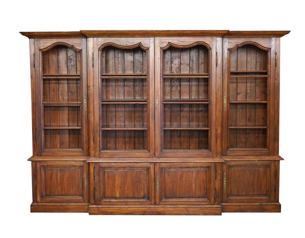 Appraisal: FRENCH PROVINCIAL-STYLE BREAKFRONT CABINET th century stained pine the wire