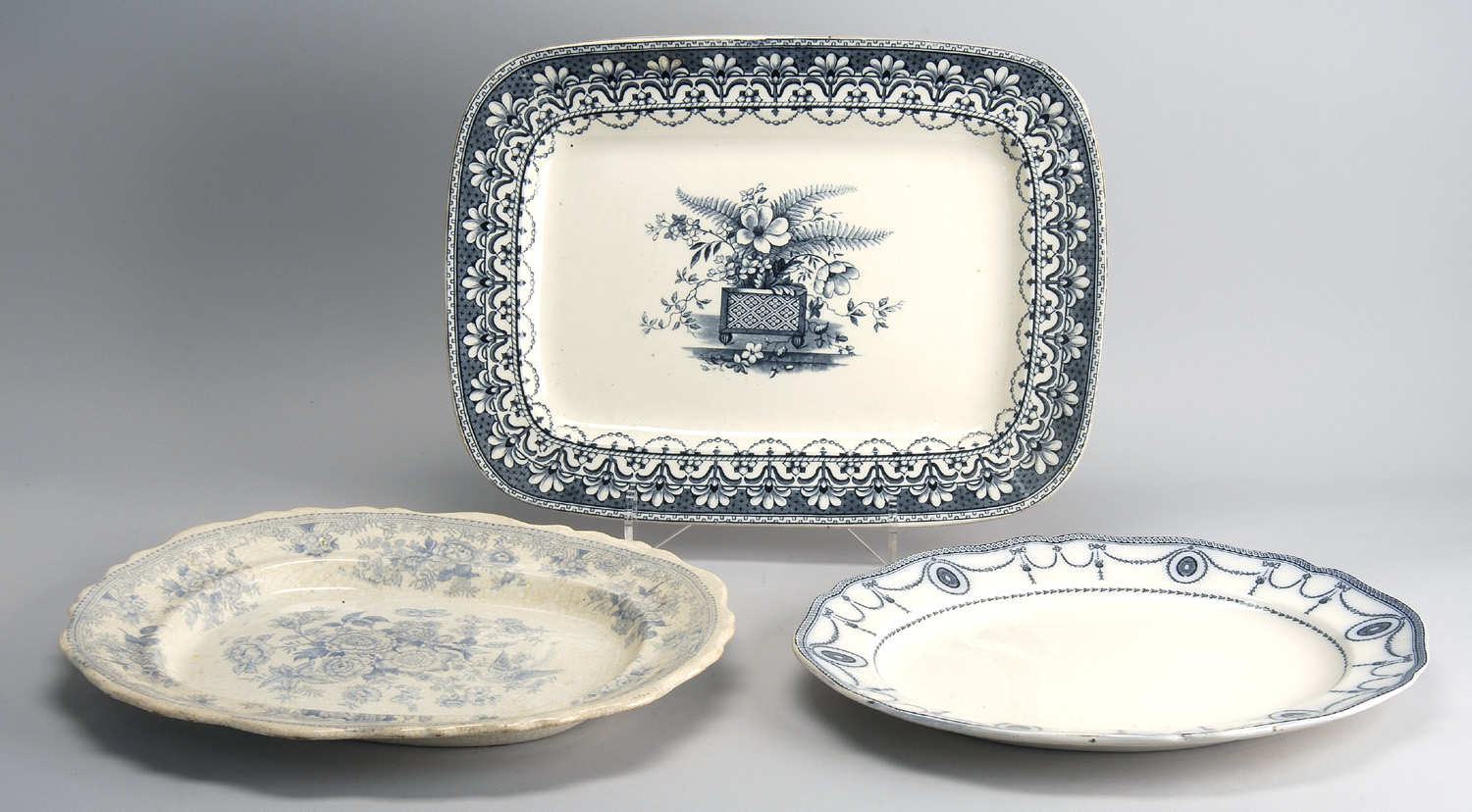 Appraisal: THREE LATE TH EARLY TH CENTURY ENGLISH IRONSTONE PLATTERS with