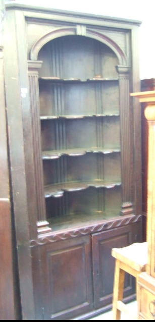 Appraisal: A George III oak freestanding barrel back corner cupboard with