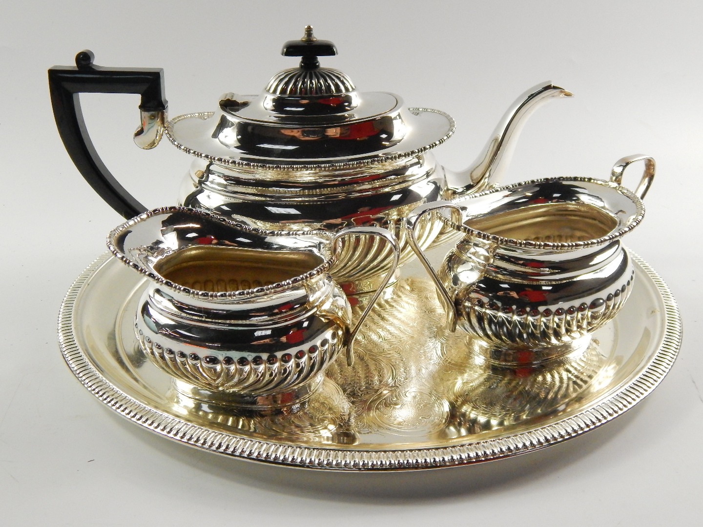 Appraisal: A plated semi fluted three piece tea set comprising teapot