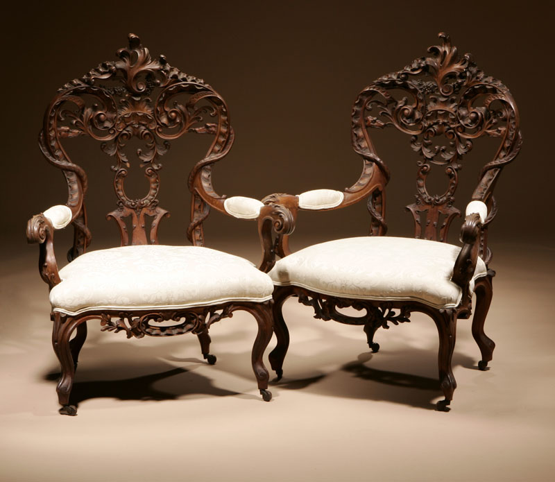 Appraisal: A pair of Italian Rococo style walnut armchairs A pair