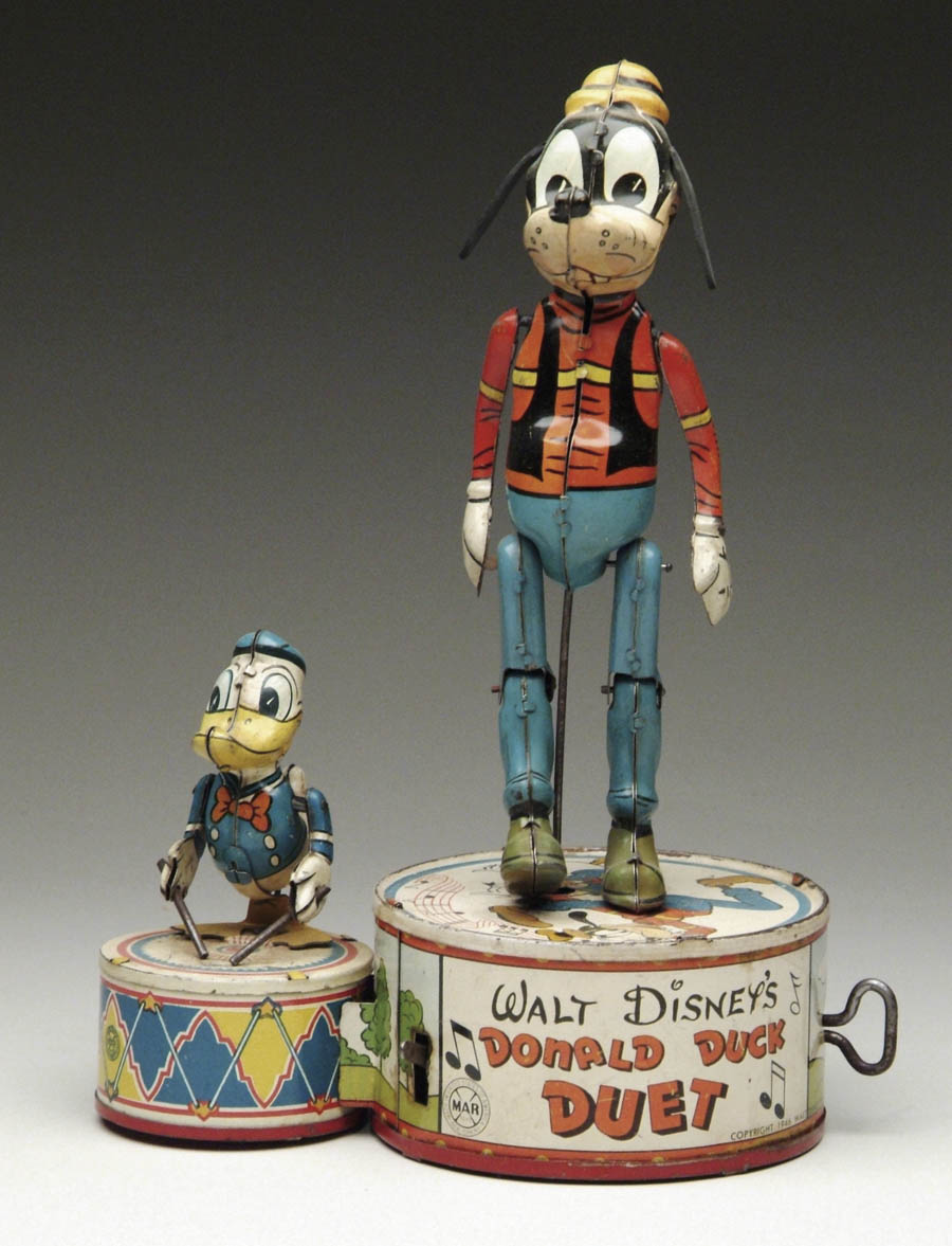 Appraisal: DONALD DUCK DUET Large tin Goofy dancing on a tin