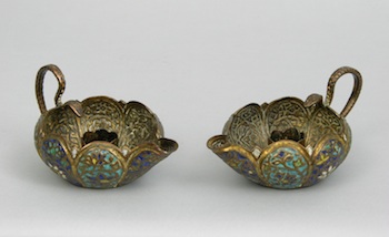 Appraisal: A Pair of Persian Candle Holders ca th Century Matched