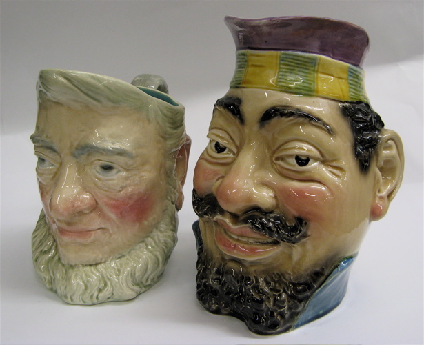 Appraisal: TWO FRENCH MAJOLICA CHARACTER JUGS The Scottsman - H marked