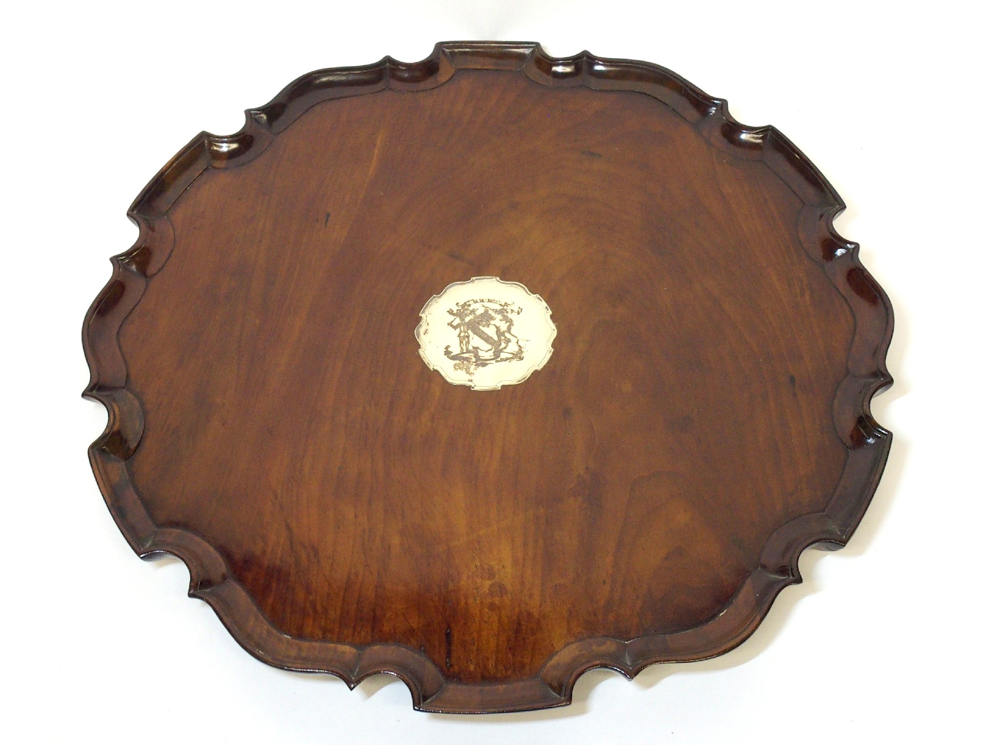 Appraisal: A Victorian oak and silver tea traythe round tray with