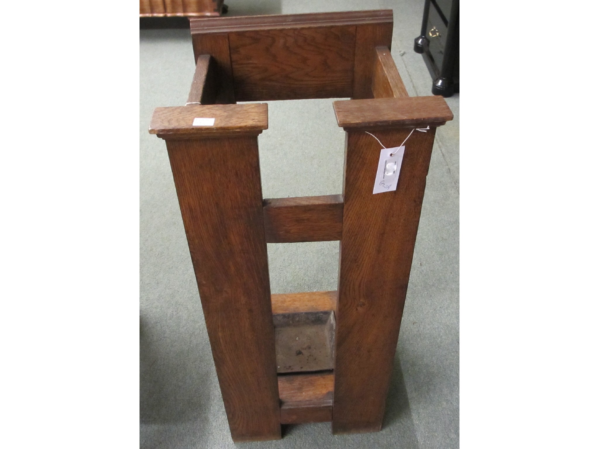 Appraisal: An Arts and Crafts oak stick stand