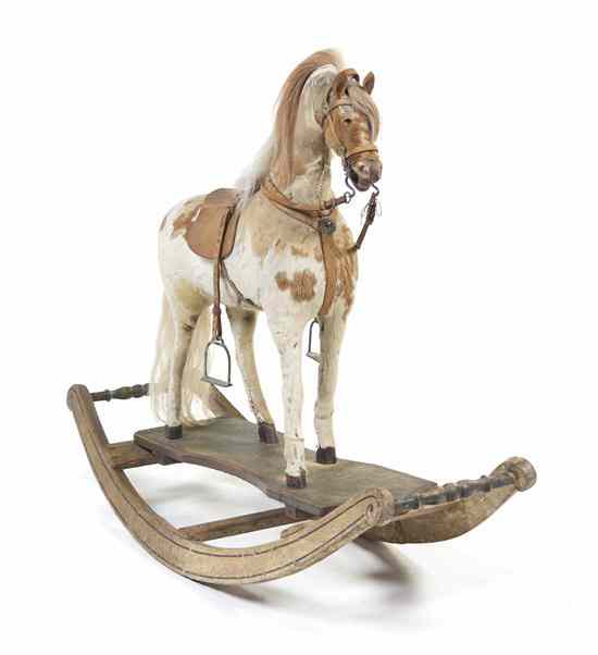 Appraisal: A Victorian Rocking Horse realistically modeled with horse hair and