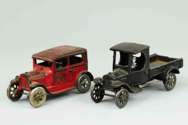 Appraisal: ARCADE SEDAN AND TRUCK Cast iron includes two door red