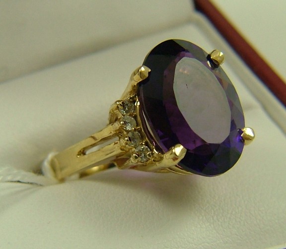 Appraisal: AMETHYST AND DIAMOND RING K yellow gold set with an