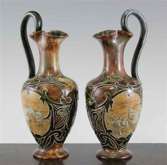 Appraisal: A pair of Royal Doulton stoneware ewers by Hannah Barlow