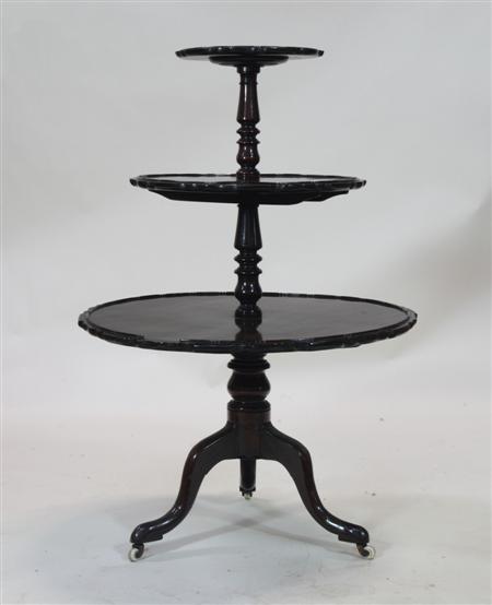 Appraisal: A George III style mahogany three tier dumb waiter with