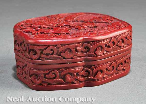 Appraisal: A Chinese Cinnabar Lacquer Flori-Form Box th c the cover