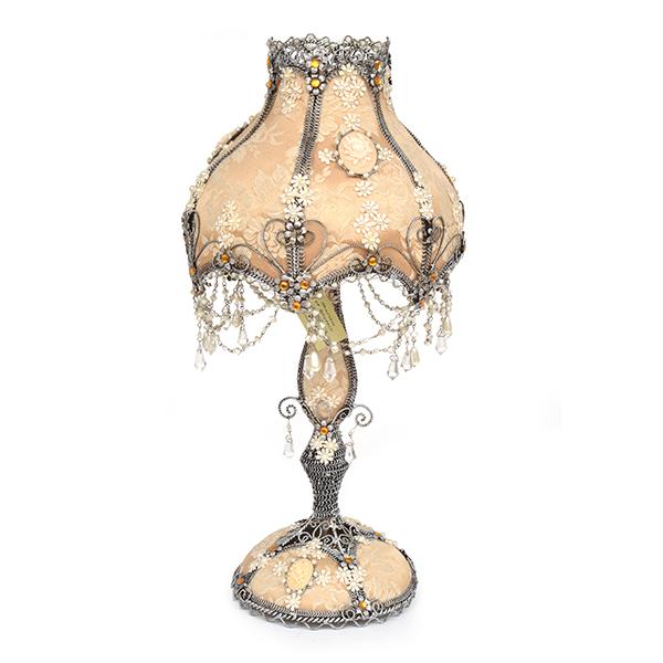 Appraisal: A DECORATIVE CLOTH UPHOLSTERED LAMP CM HIGH