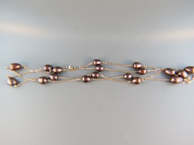 Appraisal: Chocolate Pearl k Gold Necklace pearls in link chain long