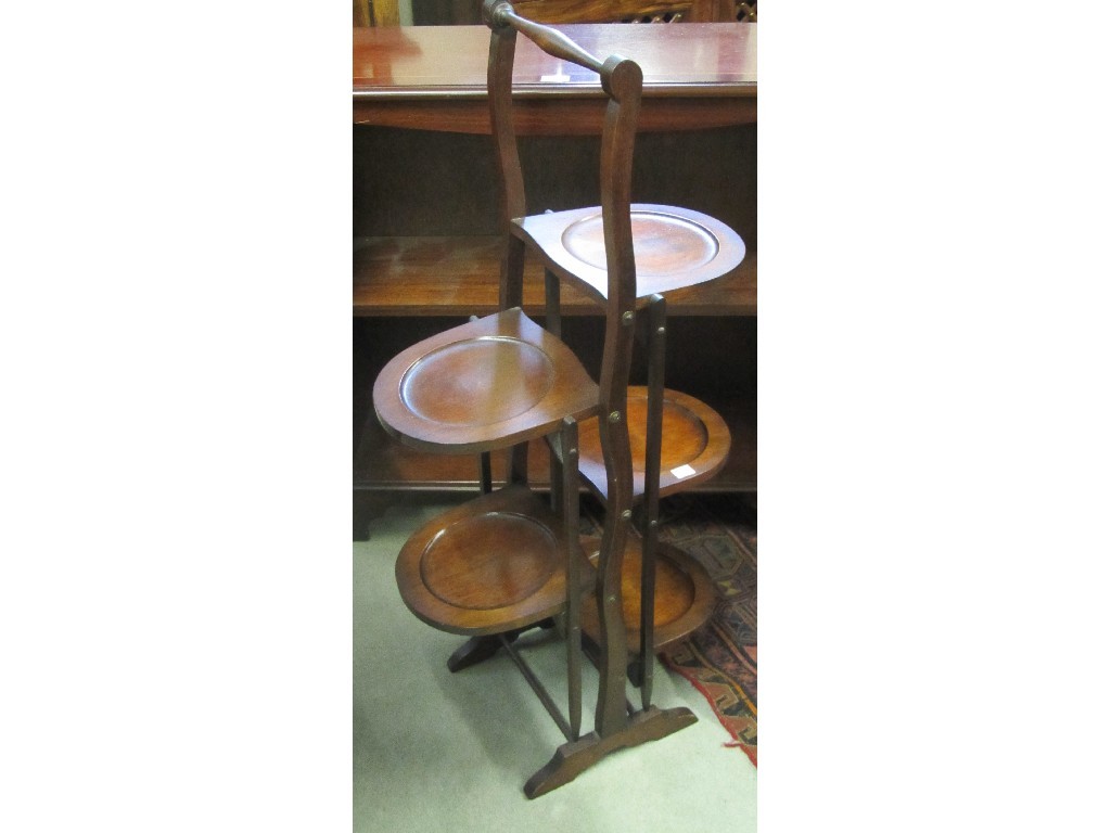 Appraisal: Modern open bookcase double folding cakestand and writing bureau and