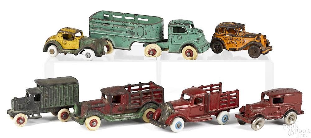 Appraisal: Seven small cast iron vehicles Seven small cast iron vehicles