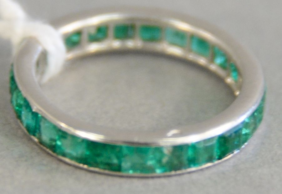 Appraisal: Platinum and emerald eternity band ring with square channel set