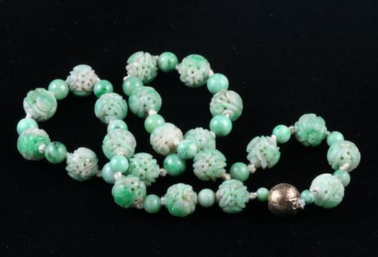 Appraisal: CHINESE CARVED APPLE GREEN JADE BEAD NECKLACE Pierced and carved