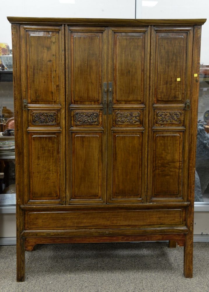 Appraisal: Chinese Elmwood cupboard th C paneled doors opening to an