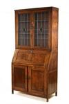 Appraisal: SECRETARY - Circa English oak bookcase top secretary Applied floral